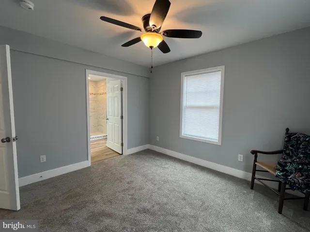 a bathroom with a shower and a sink