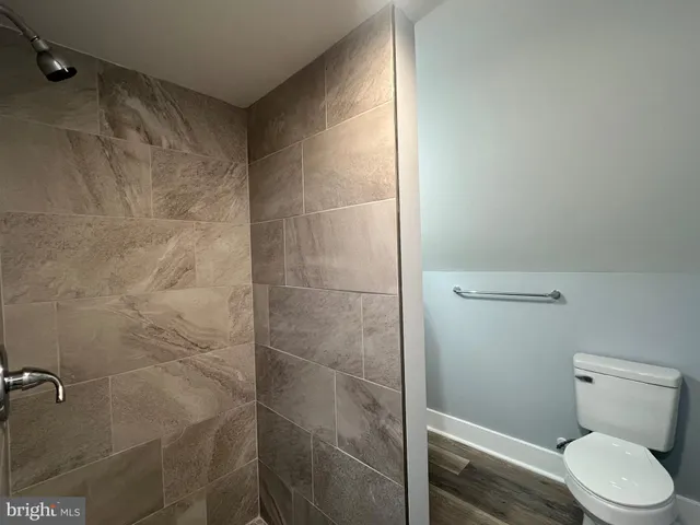 a view of a storage and utility room with washer and dryer