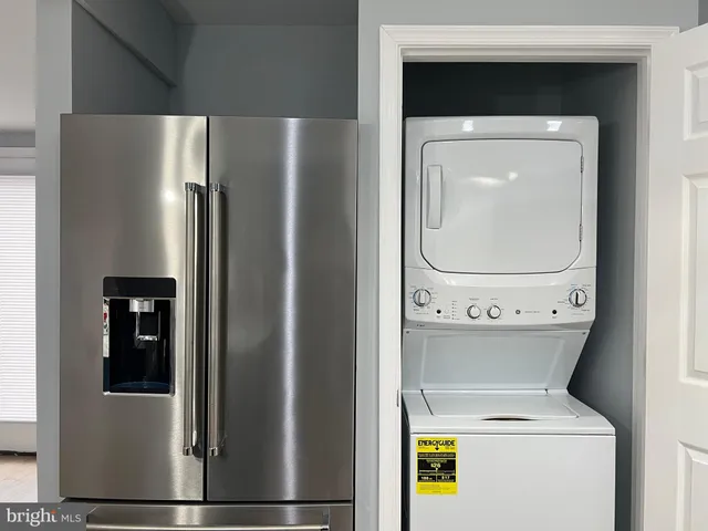 a view of a house with backyard and trees