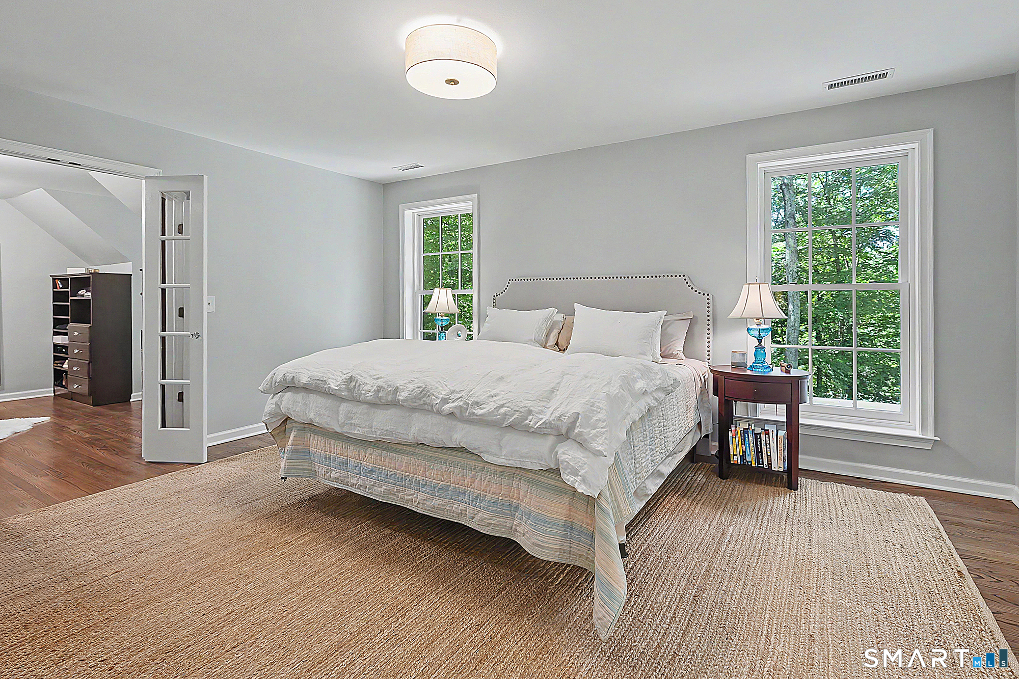 33 Hunter Lane Ridgefield, CT 06877 - Photo 22 of 39 a bedroom with a bed and a table