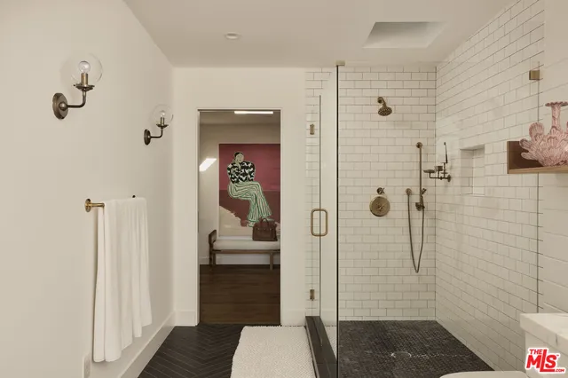 a view of a workspace with furniture and wooden floor