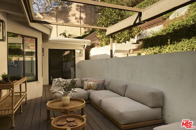 a view of a chairs and table on the deck