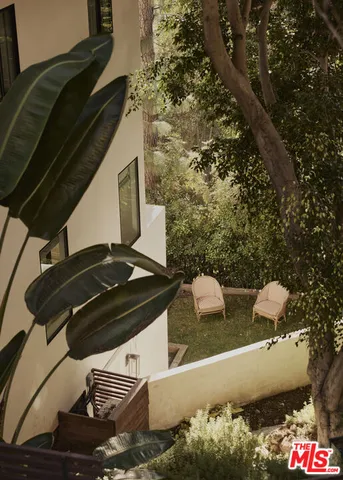 a view of outdoor space with a table and chairs