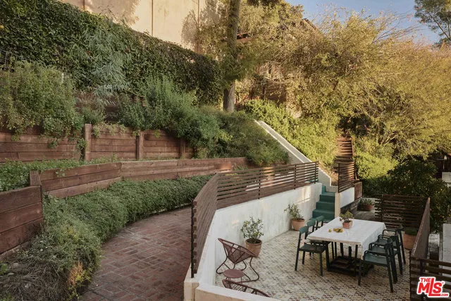 a view of staircase with a black gate