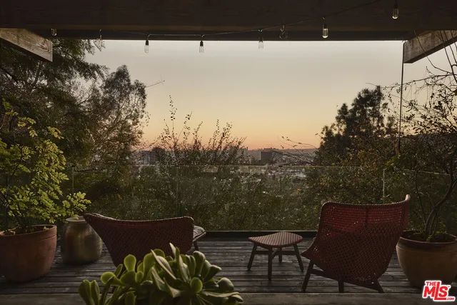 a view of a house with a tree