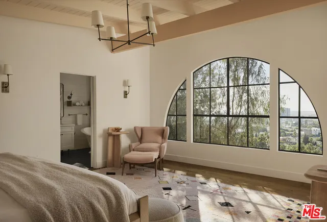 a bedroom with a bed and ceiling fan