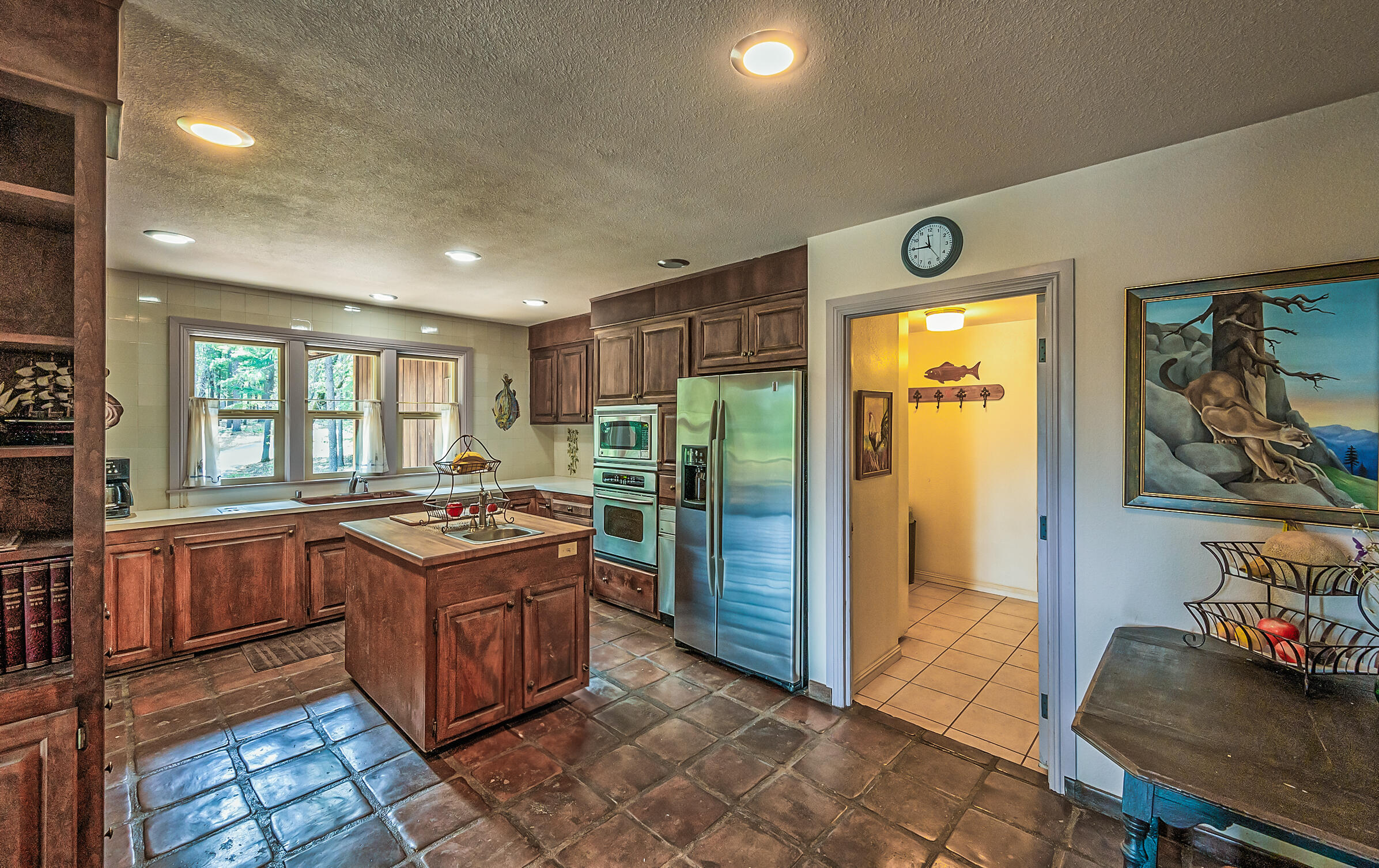 29230 Fenders Ferry Road Bella Vista, CA 96008 - Photo 18 of 60 a kitchen with stainless steel appliances granite countertop a sink and cabinets