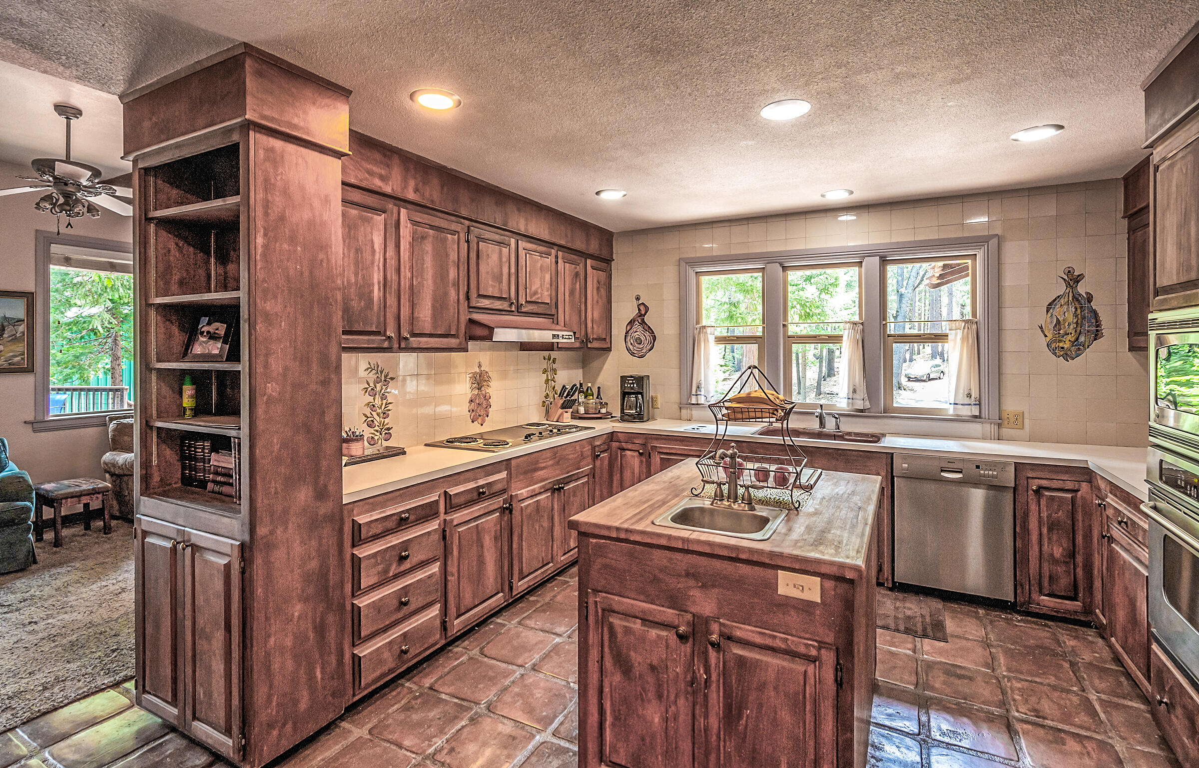 29230 Fenders Ferry Road Bella Vista, CA 96008 - Photo 19 of 60 a kitchen with stainless steel appliances granite countertop a stove a sink and a refrigerator