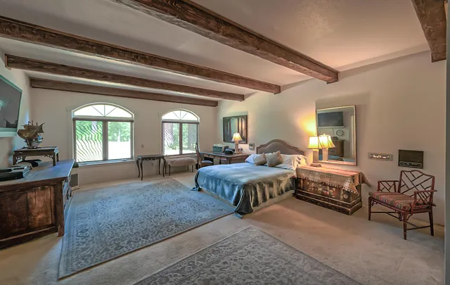 a bathroom with a sink mirror and a bathtub
