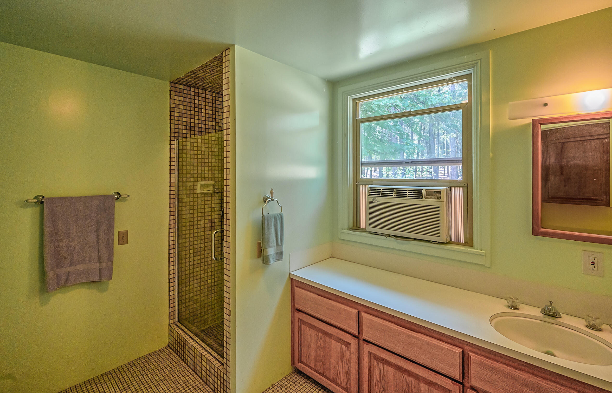 29230 Fenders Ferry Road Bella Vista, CA 96008 - Photo 25 of 60 a bathroom with a sink and a mirror