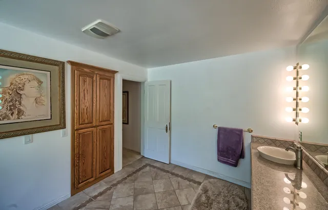 a view of entryway with wooden floor and cabinet
