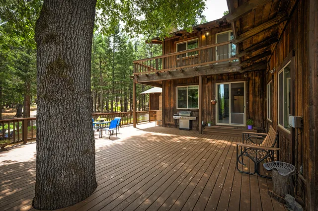 a view of backyard with outdoor seating
