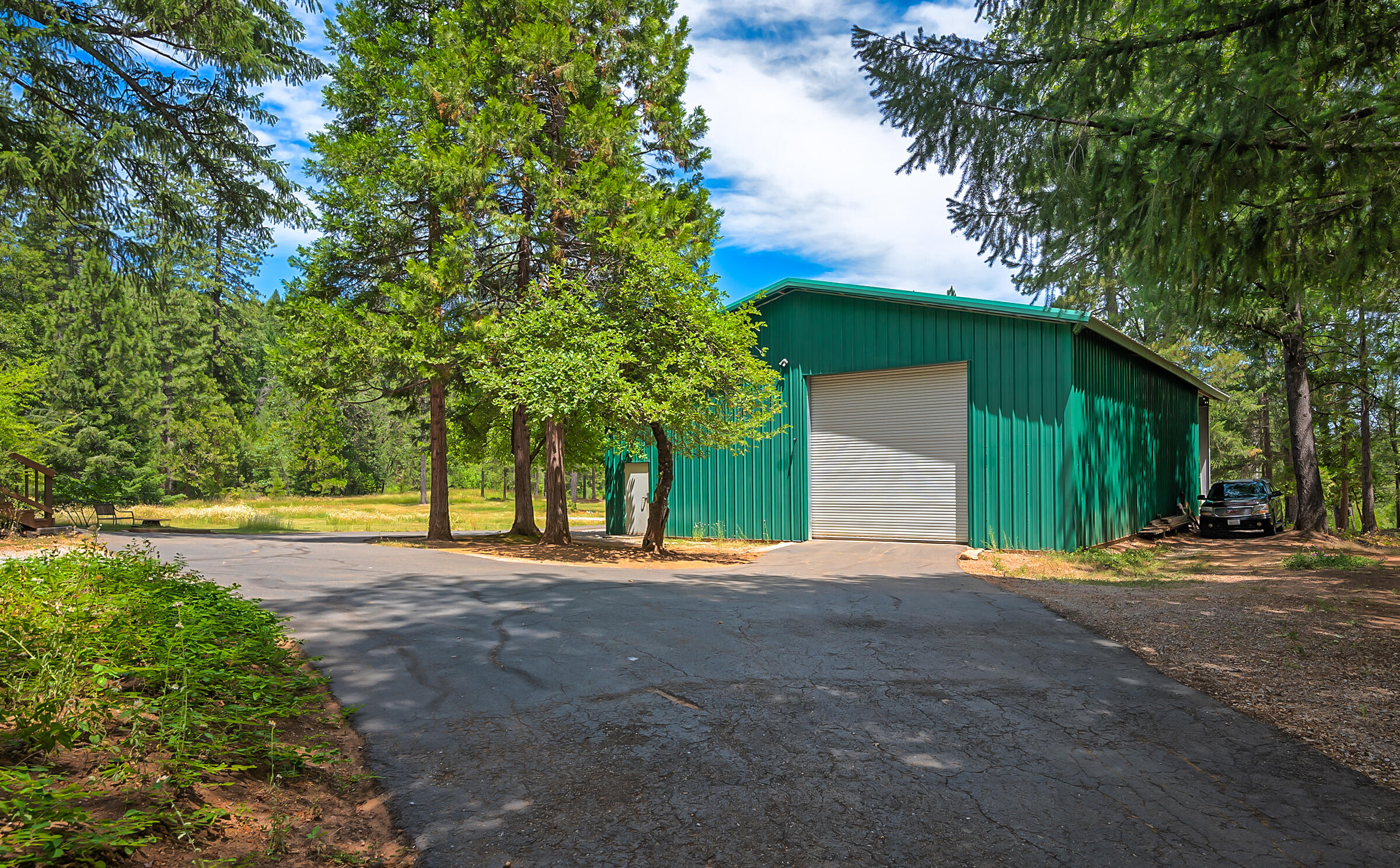 29230 Fenders Ferry Road Bella Vista, CA 96008 - Photo 44 of 60 a front view of a house with a yard and trees