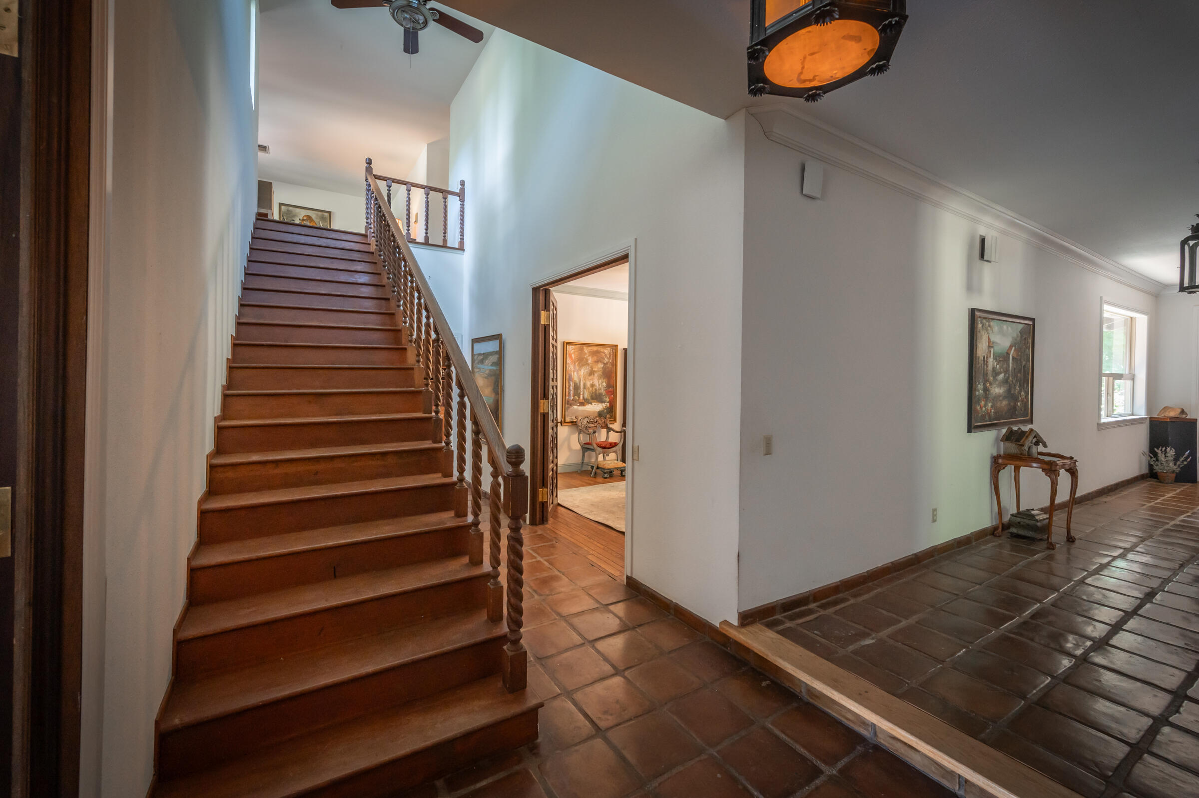 29230 Fenders Ferry Road Bella Vista, CA 96008 - Photo 10 of 60 a view of a hallway with wooden floor and staircase