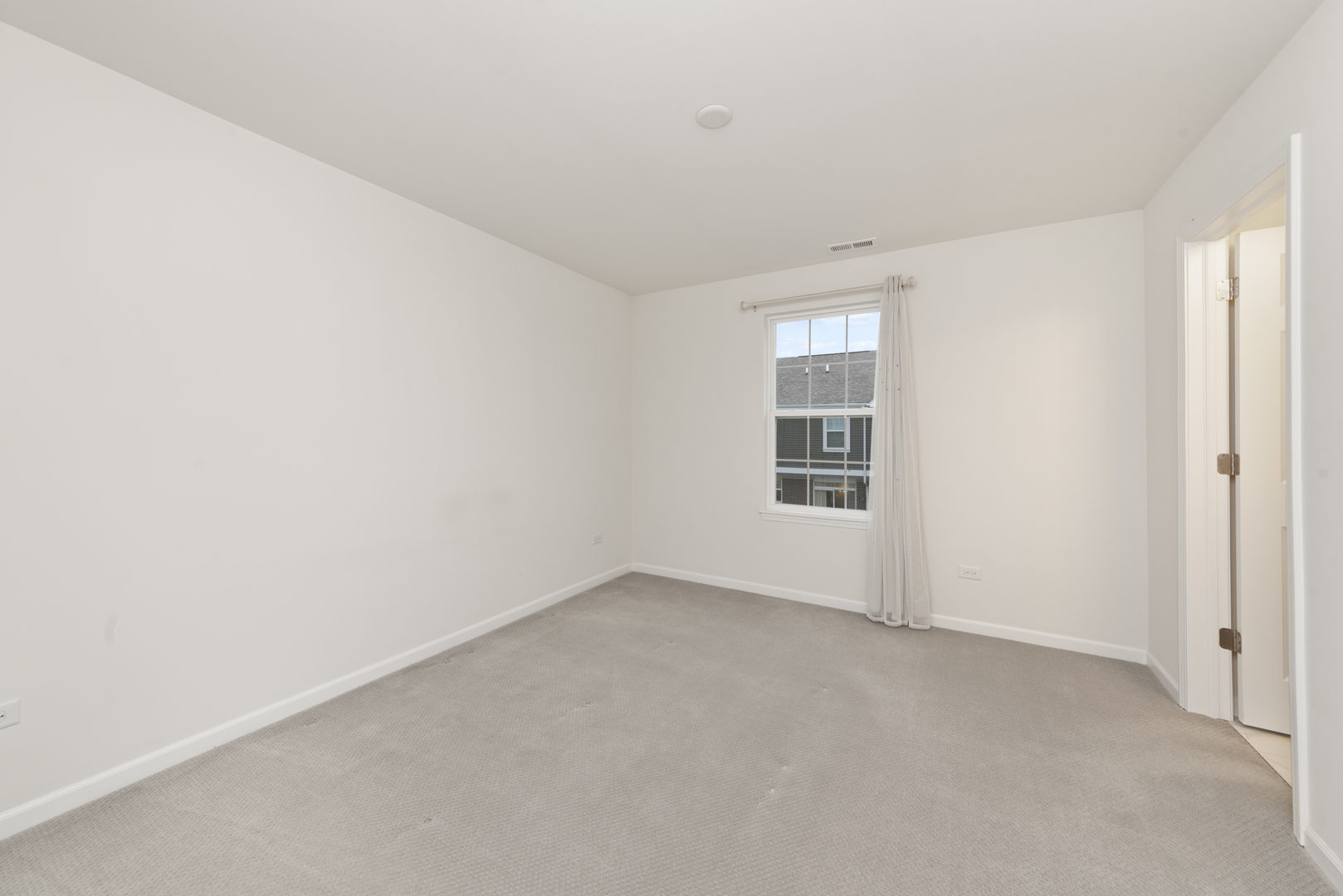 4431 Monroe Court Naperville, IL 60564 - Photo 12 of 13 an empty room with windows