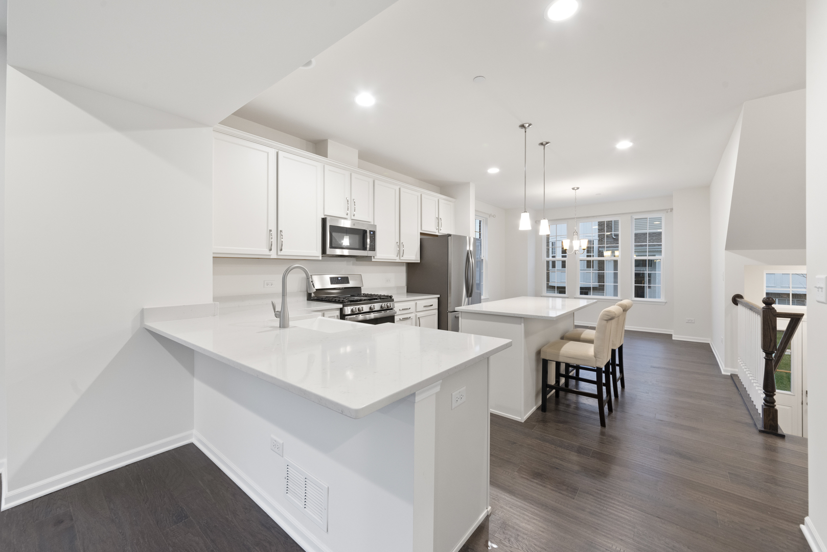 4431 Monroe Court Naperville, IL 60564 - Photo 5 of 13 a kitchen with appliances a sink a counter top space and cabinets