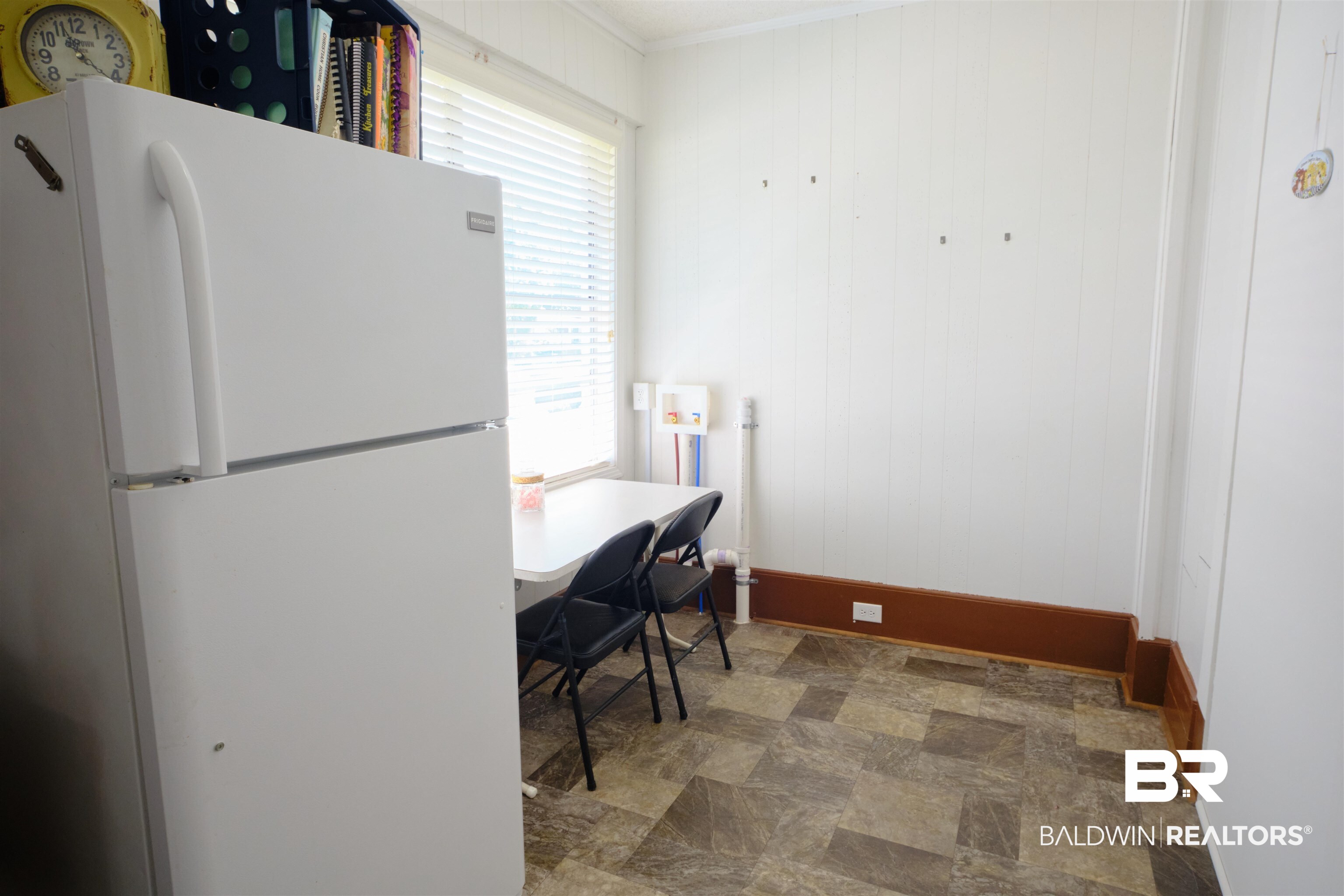 101 West Horner Street Atmore, AL 36502 - Photo 26 of 38 Interior space with ornamental molding, white fridge, and tile patterned floors