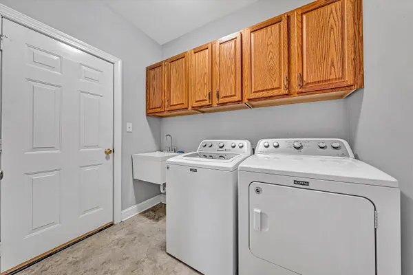 a bathroom with a sink double vanity mirror and a bathtub