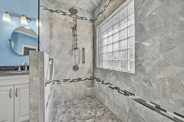 a bathroom with a sink a vanity and mirror