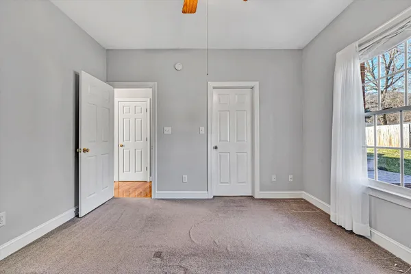 a view of an empty room with windows
