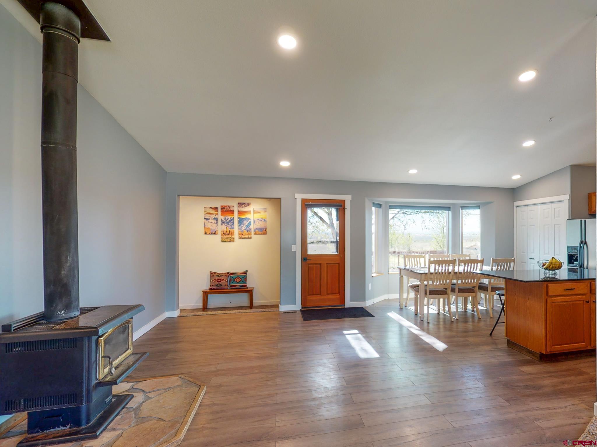 1819 Rolling Road Cortez, CO 81321 - Photo 12 of 35 a view of a kitchen with furniture and wooden floor