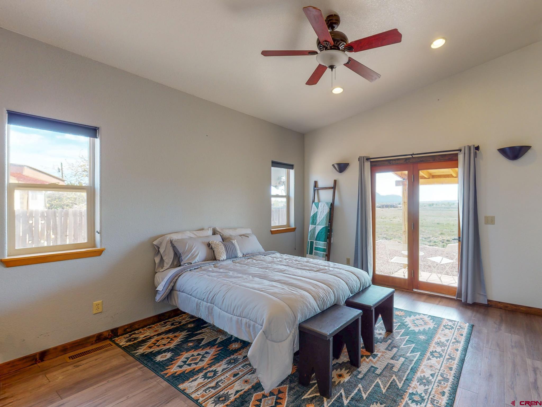 1819 Rolling Road Cortez, CO 81321 - Photo 17 of 35 a spacious bedroom with a bed and a window
