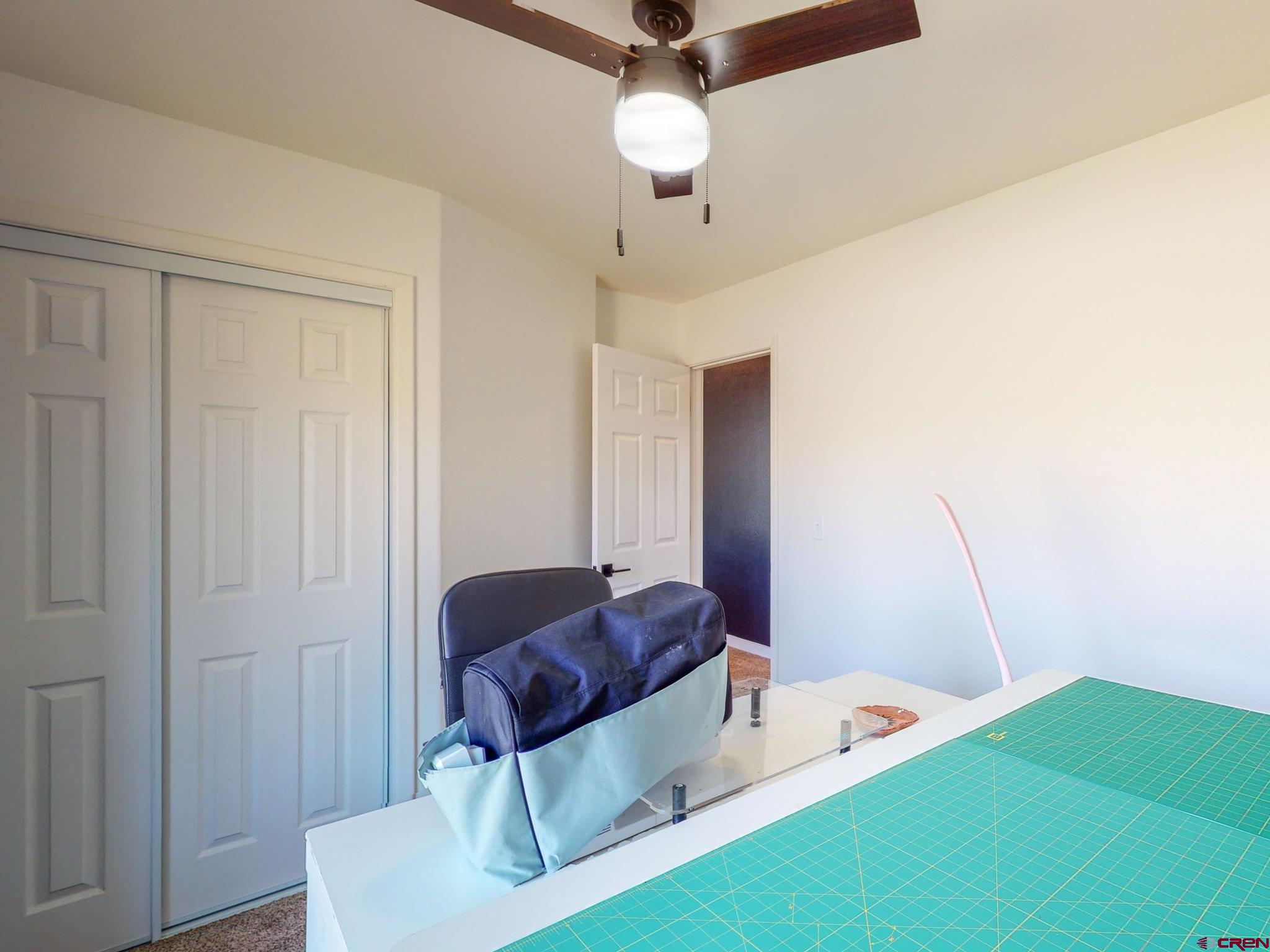 1819 Rolling Road Cortez, CO 81321 - Photo 29 of 35 a room with a bed and a dresser
