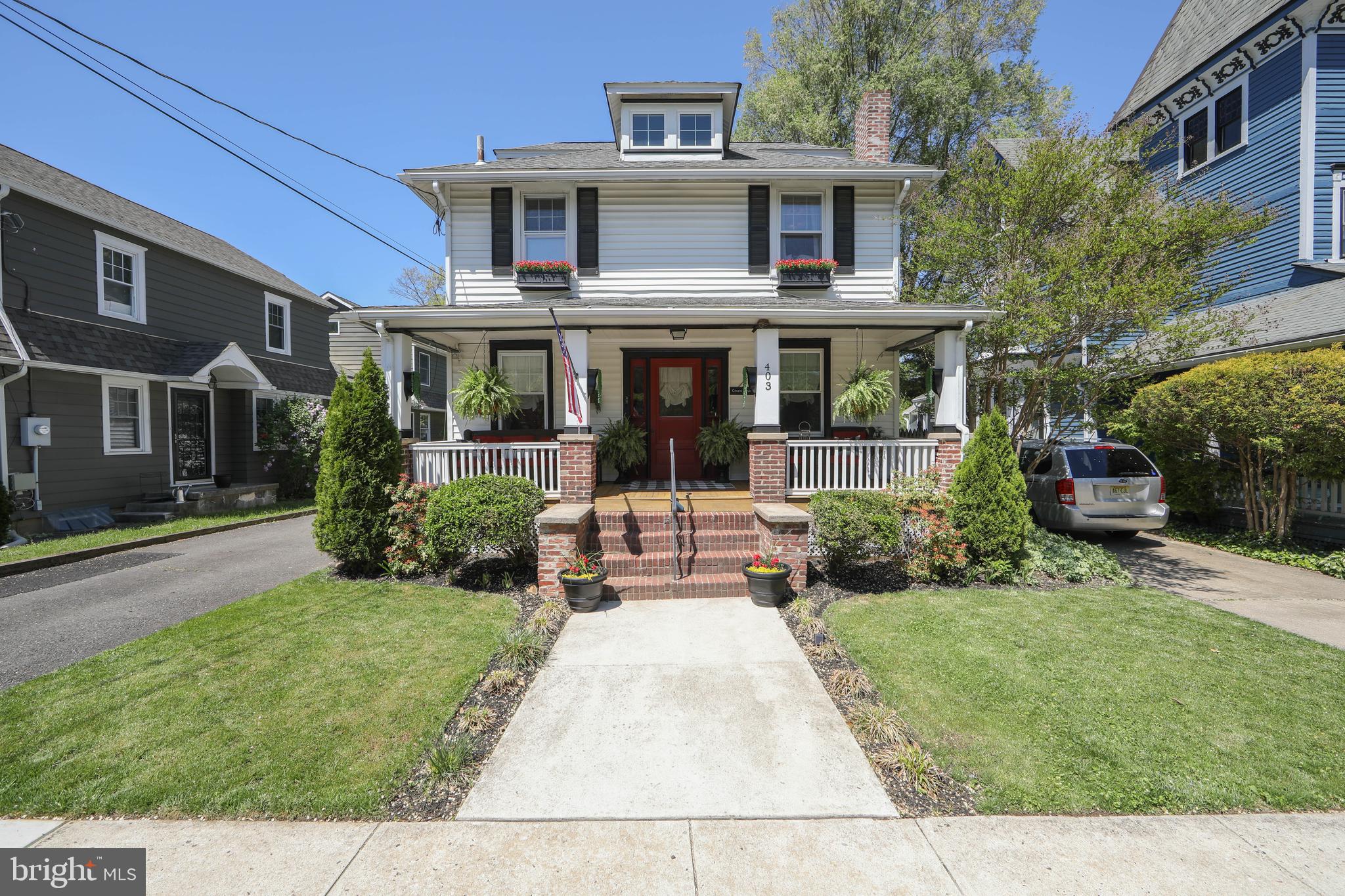 a view of a brick house with a yard