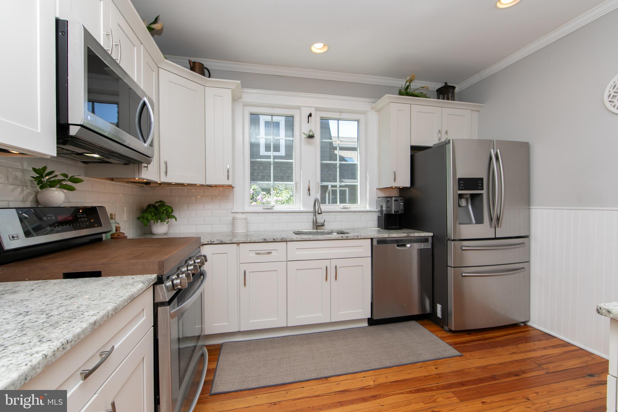 403 Belmont Avenue Haddonfield, NJ 08033 - Photo 17 of 47 a kitchen with stainless steel appliances granite countertop a refrigerator stove and sink