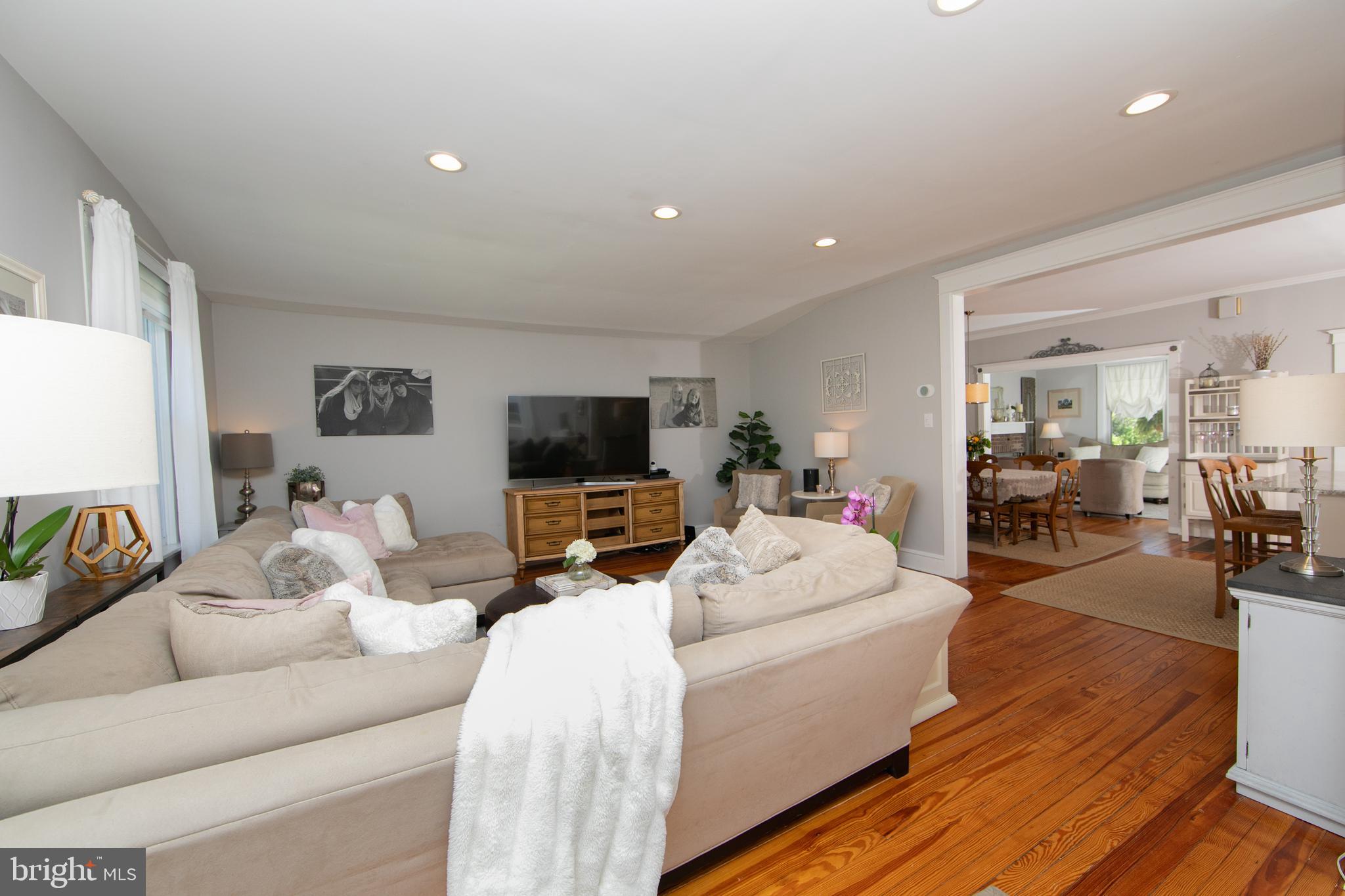 403 Belmont Avenue Haddonfield, NJ 08033 - Photo 23 of 47 a living room with furniture a flat screen tv and a refrigerator