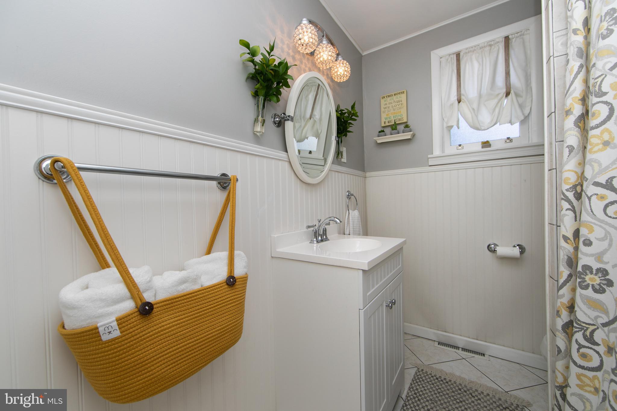 403 Belmont Avenue Haddonfield, NJ 08033 - Photo 26 of 47 a bathroom with a sink mirror and vanity