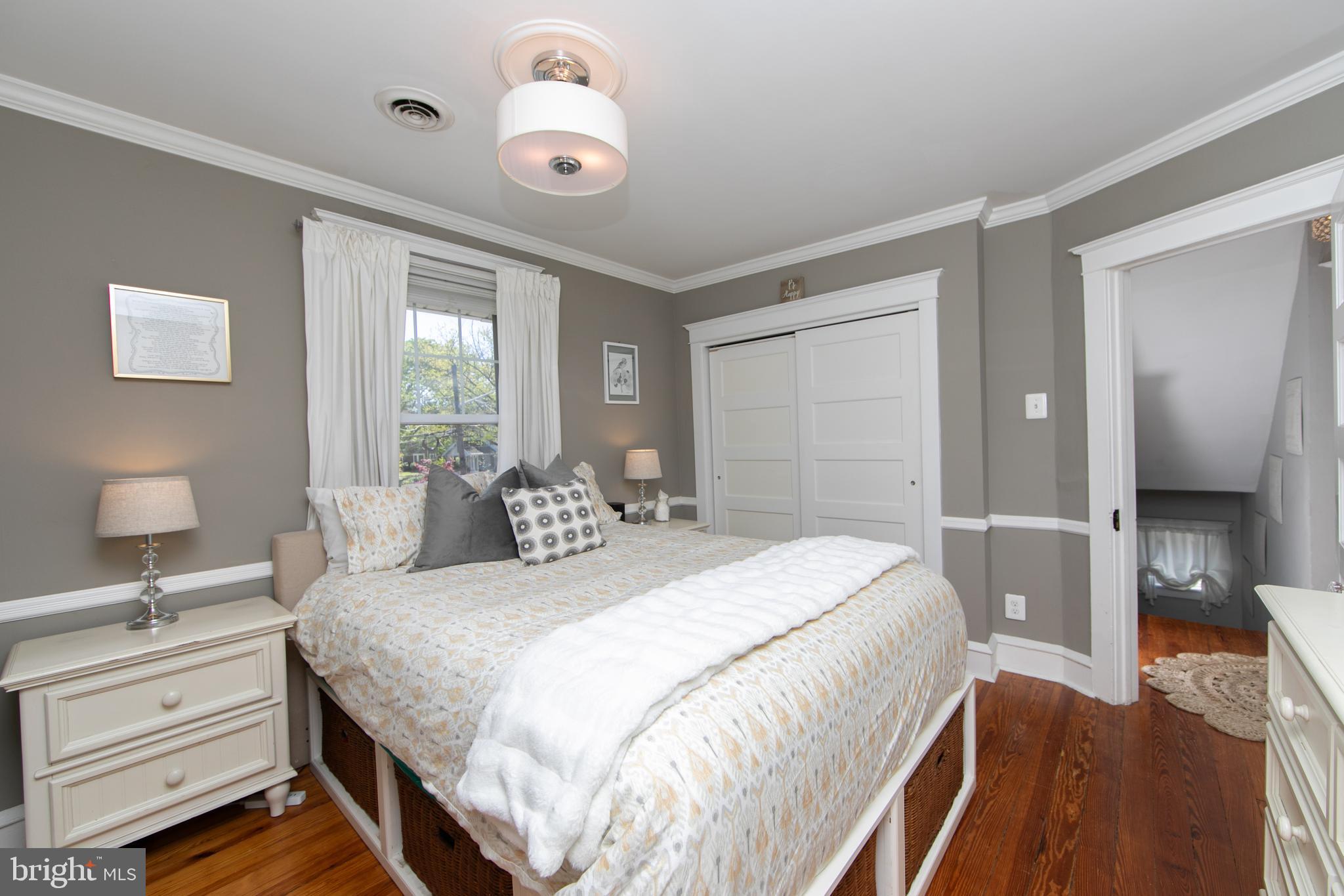 403 Belmont Avenue Haddonfield, NJ 08033 - Photo 28 of 47 a bedroom with a bed and a chandelier