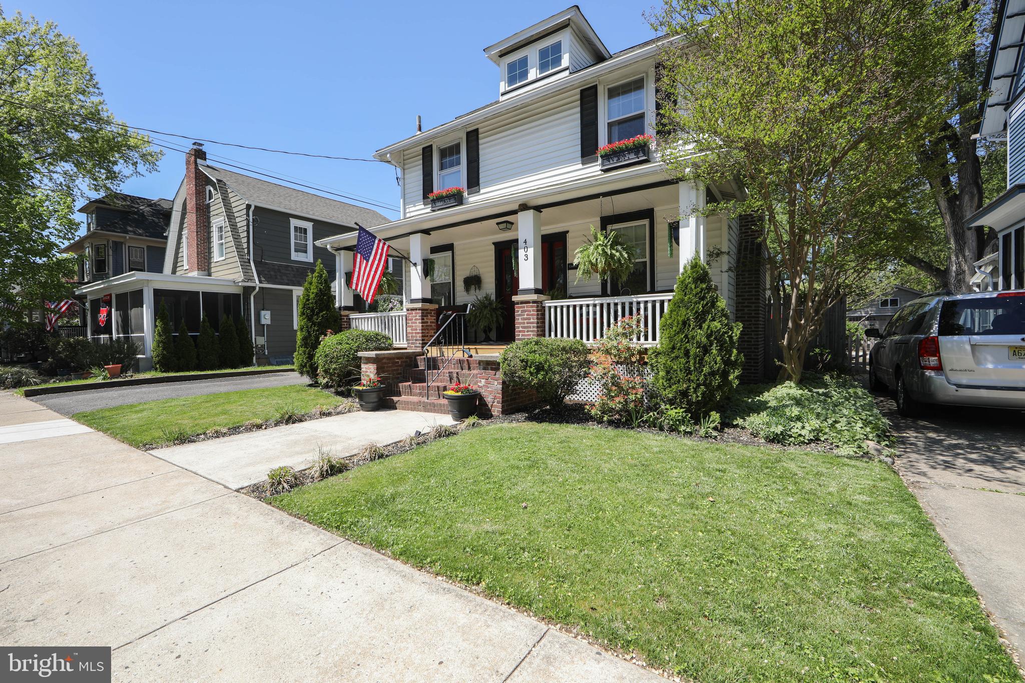 403 Belmont Avenue Haddonfield, NJ 08033 - Photo 3 of 47 a view of a brick house with a yard and plants