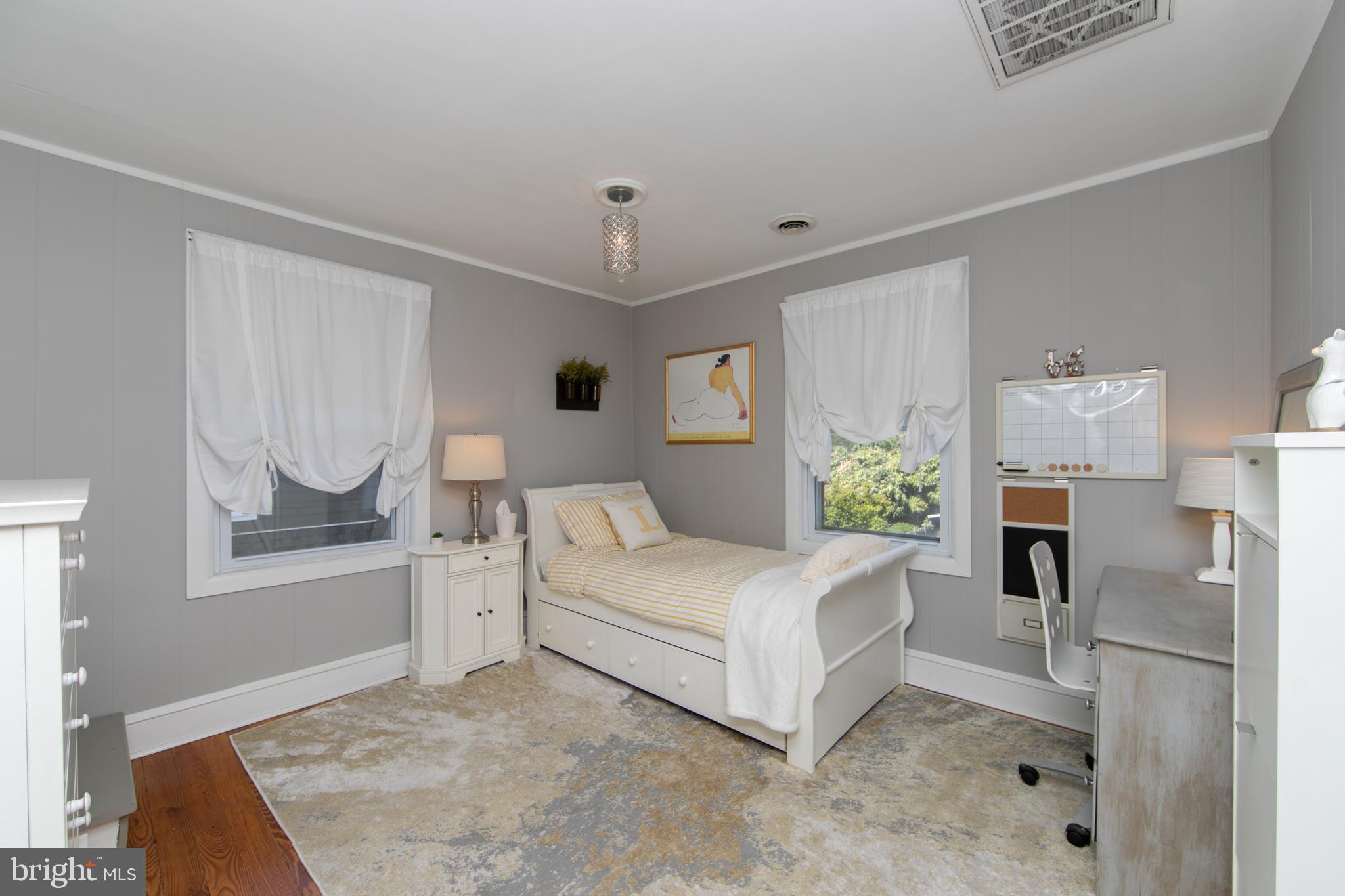 403 Belmont Avenue Haddonfield, NJ 08033 - Photo 32 of 47 a bedroom with a bed dresser and a window