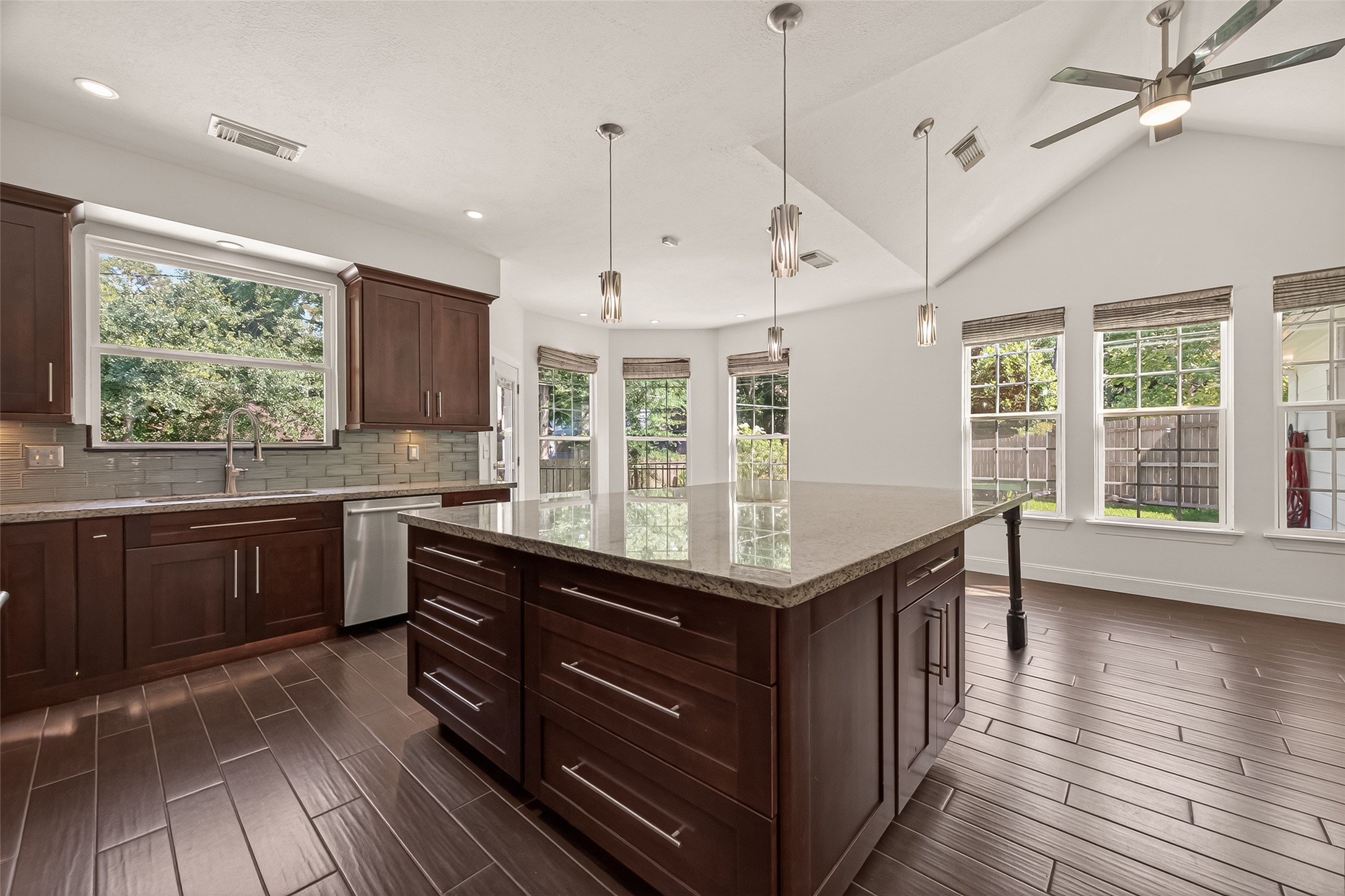 6131 Hampton Way Court Spring, TX 77389 - Photo 14 of 50 a kitchen with granite countertop counter space a sink appliances and a large window