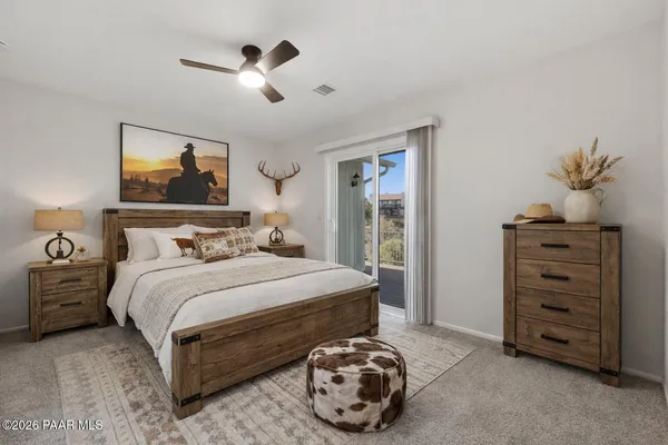 an empty room with closet and windows