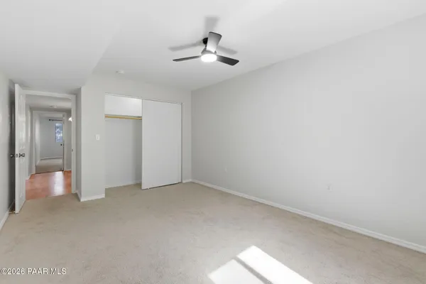 an aerial view of a house with a mountain