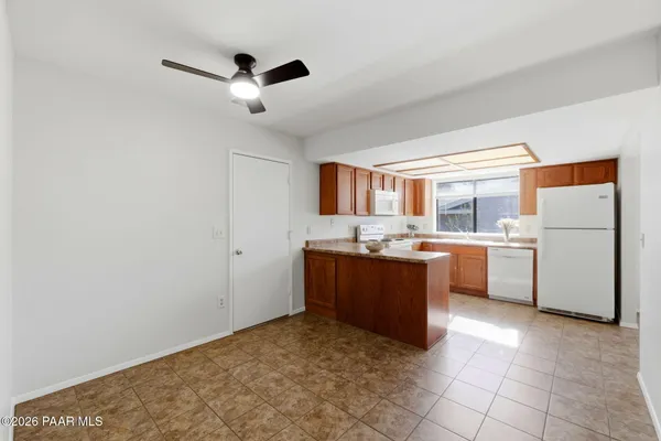 a kitchen with a refrigerator and a sink