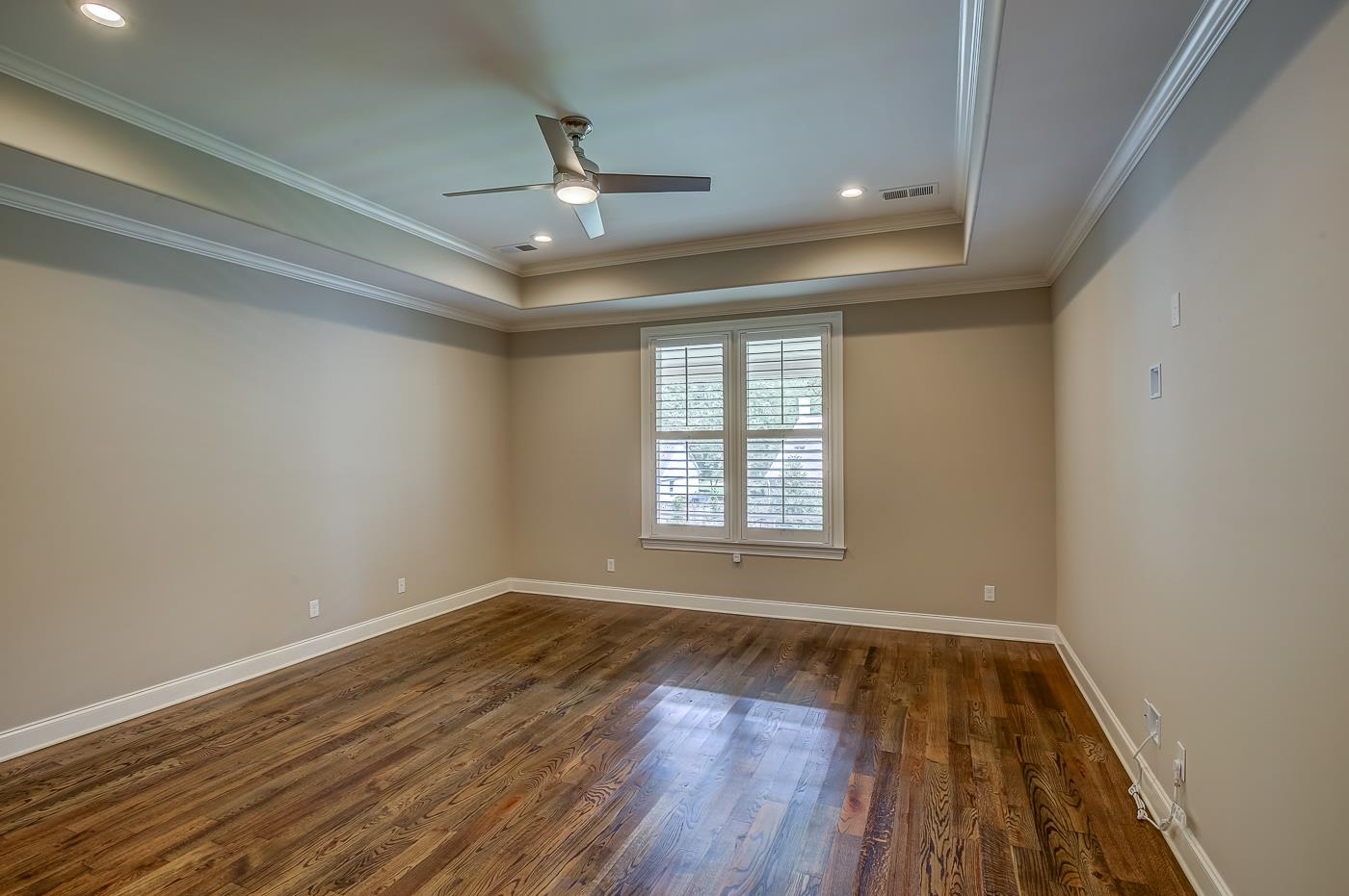 1908 Riverdale Road Germantown, TN 38138 - Photo 13 of 40 10' Tray ceiling with double crown molding, 4 can lights and ceiling fan with light. Hardwood floor. Plantation Shutters which are features throughout the home.