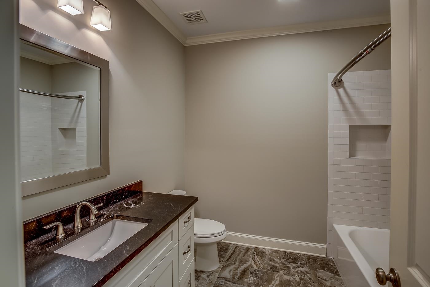 1908 Riverdale Road Germantown, TN 38138 - Photo 20 of 40 Custom tile floor. 2 piece crown molding. QUARTZ vanity with 6 drawers. Subway tile shower walls at steel tub. Linen closet.