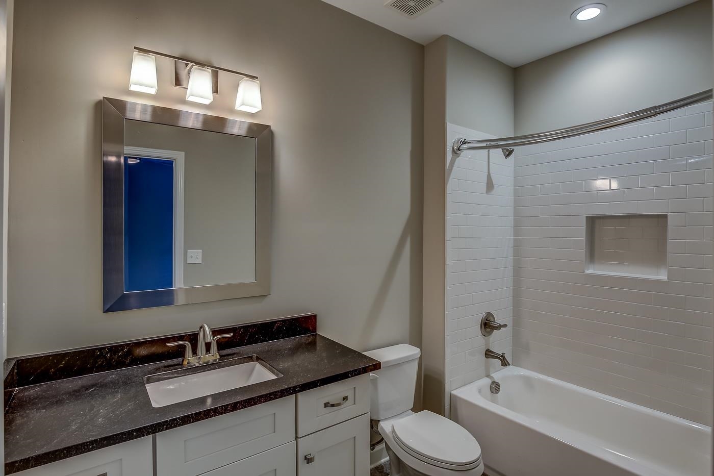 1908 Riverdale Road Germantown, TN 38138 - Photo 22 of 40 Custom tile floor. 2 piece crown molding. QUARTZ vanity with 2 drawers. Subway tile shower walls at steel tub. Linen closet.