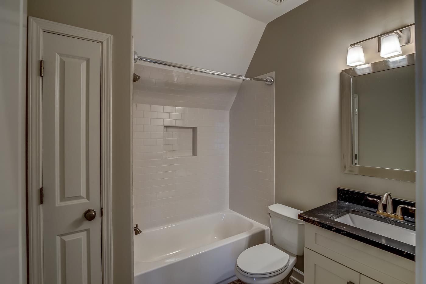 1908 Riverdale Road Germantown, TN 38138 - Photo 25 of 40 Custom tile floor. QUARTZ vanity. Subway tile shower walls at steel tub.