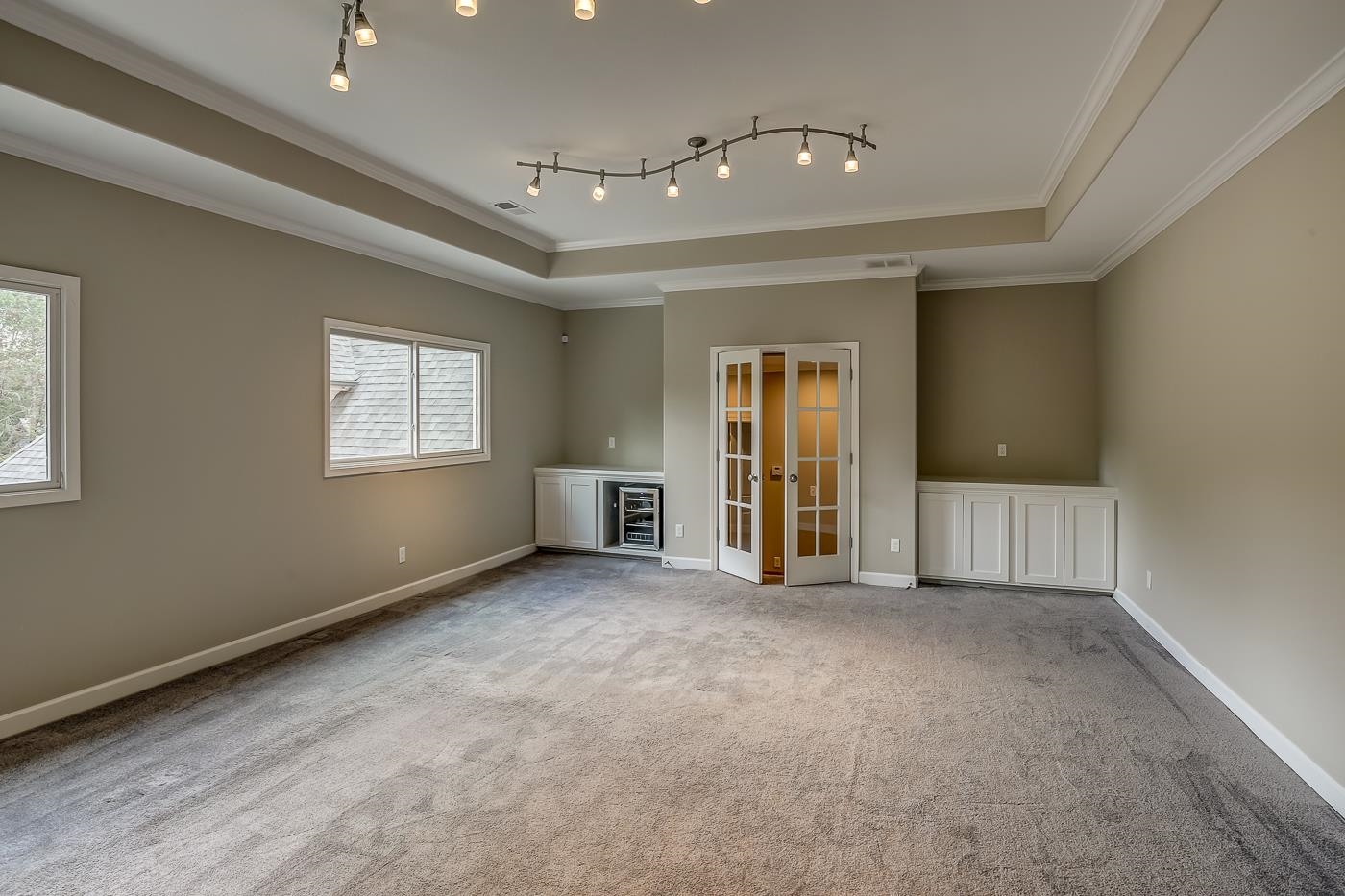 1908 Riverdale Road Germantown, TN 38138 - Photo 28 of 40 10' Tray ceiling with double 2 piece crown molding. and snake Halogen lights. Base cabinet on each side of French doors at entrance. Wine refrigerator. Plantation Shutters.
