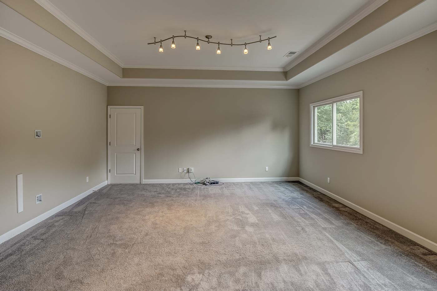 1908 Riverdale Road Germantown, TN 38138 - Photo 29 of 40 Door at rear left to large floored attic including 2 of 3 Trane HVAC furnaces and 2 tankless water heaters. Including stairway to additional attic storage and 3 HVAC furnace.