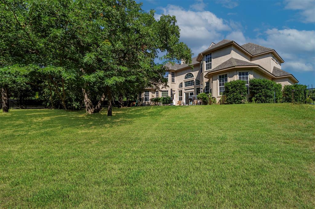 100 Manders Court Runaway Bay, TX 76426 - Photo 31 of 33 a front view of a house with a yard