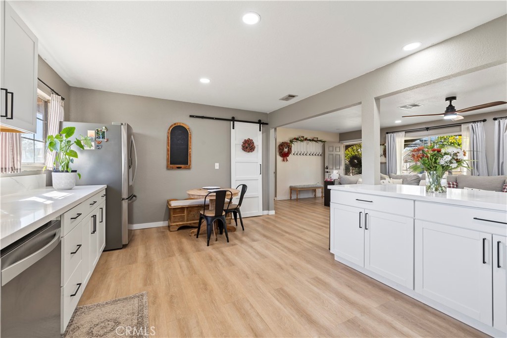8755 Devon Avenue Hesperia, CA 92345 - Photo 13 of 45 a large white kitchen with cabinets