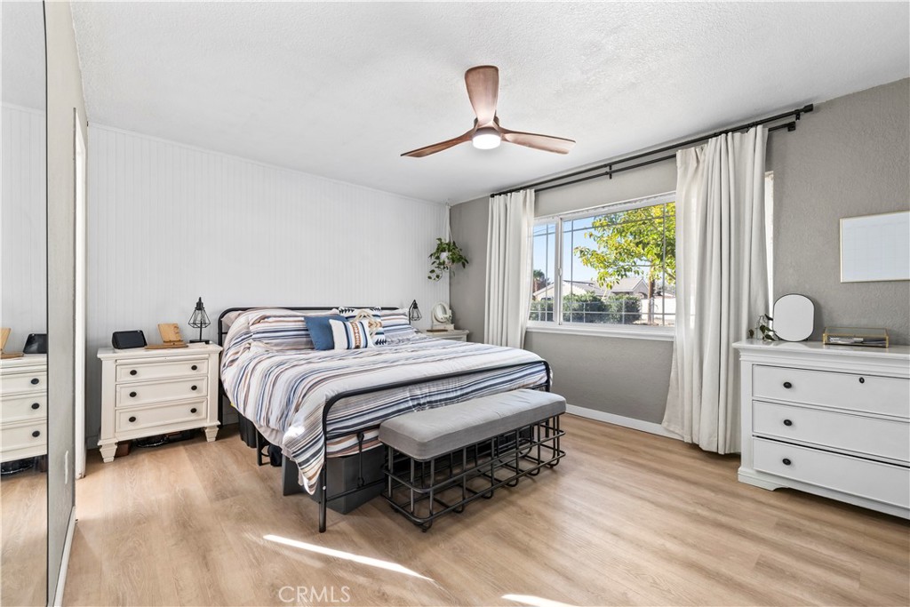 8755 Devon Avenue Hesperia, CA 92345 - Photo 14 of 45 a spacious bedroom with a bed and a window