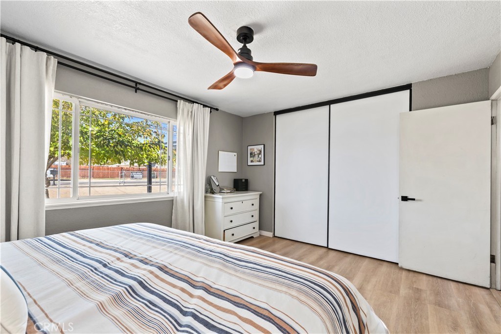 8755 Devon Avenue Hesperia, CA 92345 - Photo 16 of 45 a bedroom with a bed and a large window