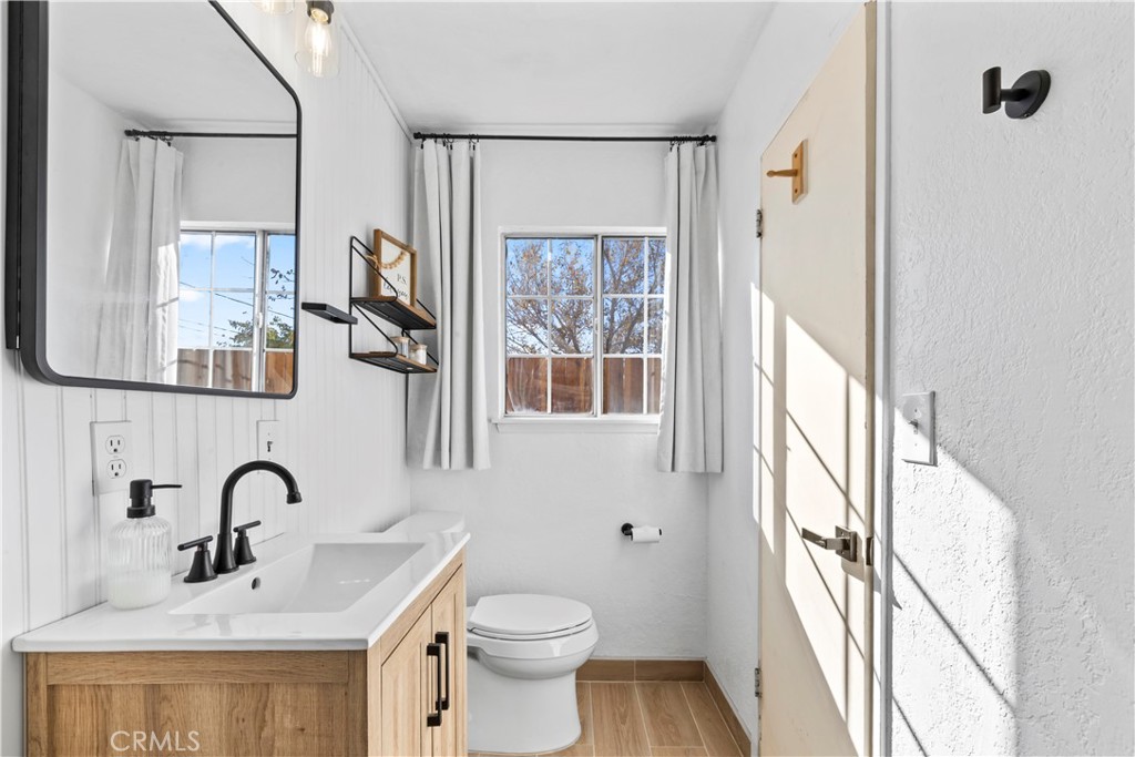 8755 Devon Avenue Hesperia, CA 92345 - Photo 19 of 45 a bathroom with a sink and a large mirror