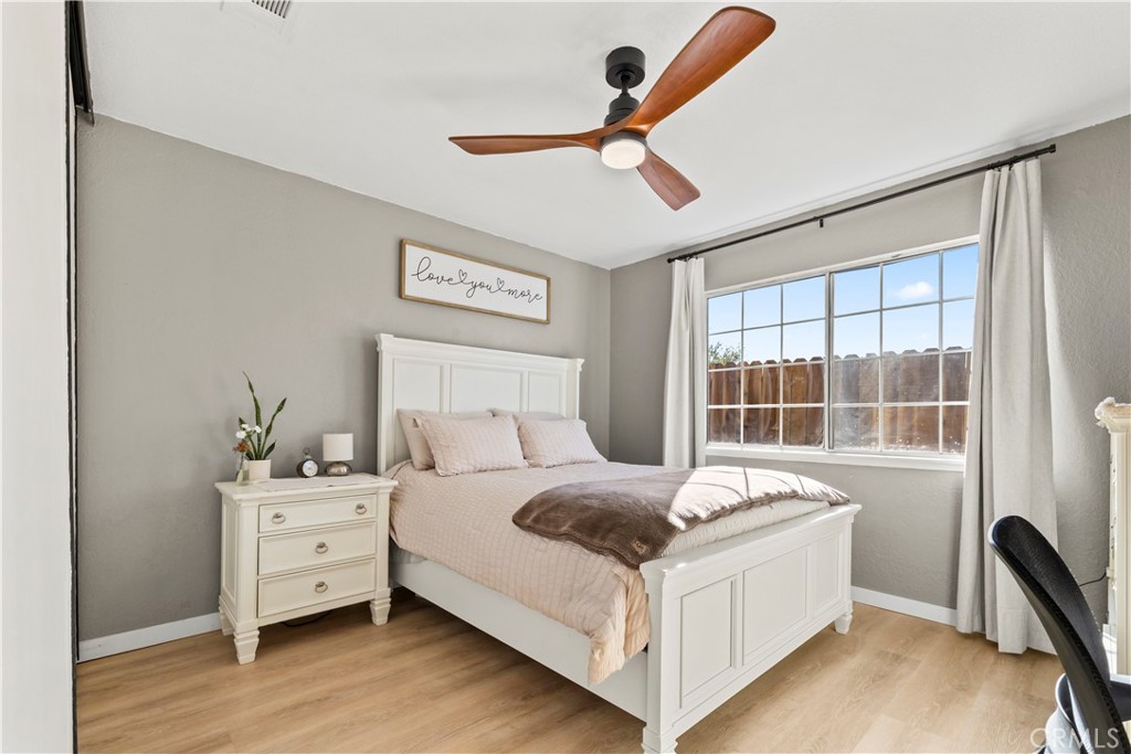 8755 Devon Avenue Hesperia, CA 92345 - Photo 20 of 45 a bedroom with a bed and a large window